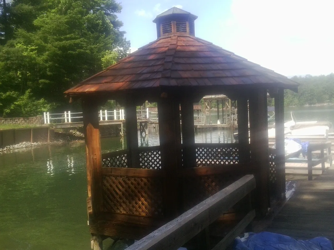 Cedar shake gazebo roof rebuilt on a lake dock in Manheim